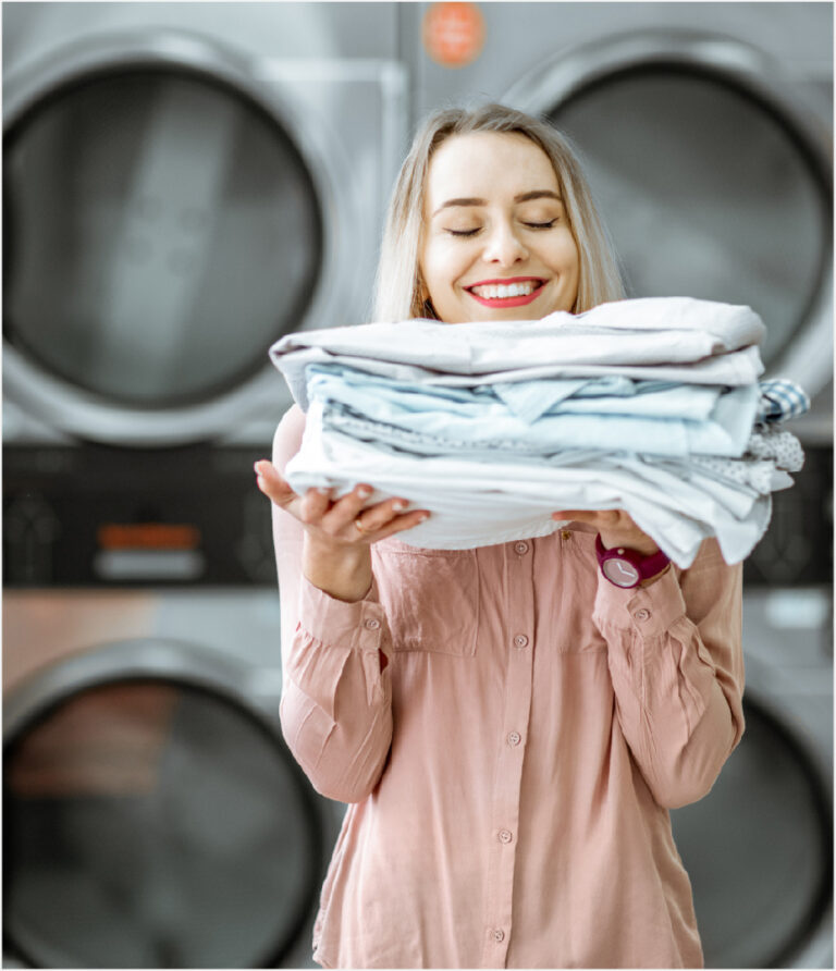 woman smelling clean laundry